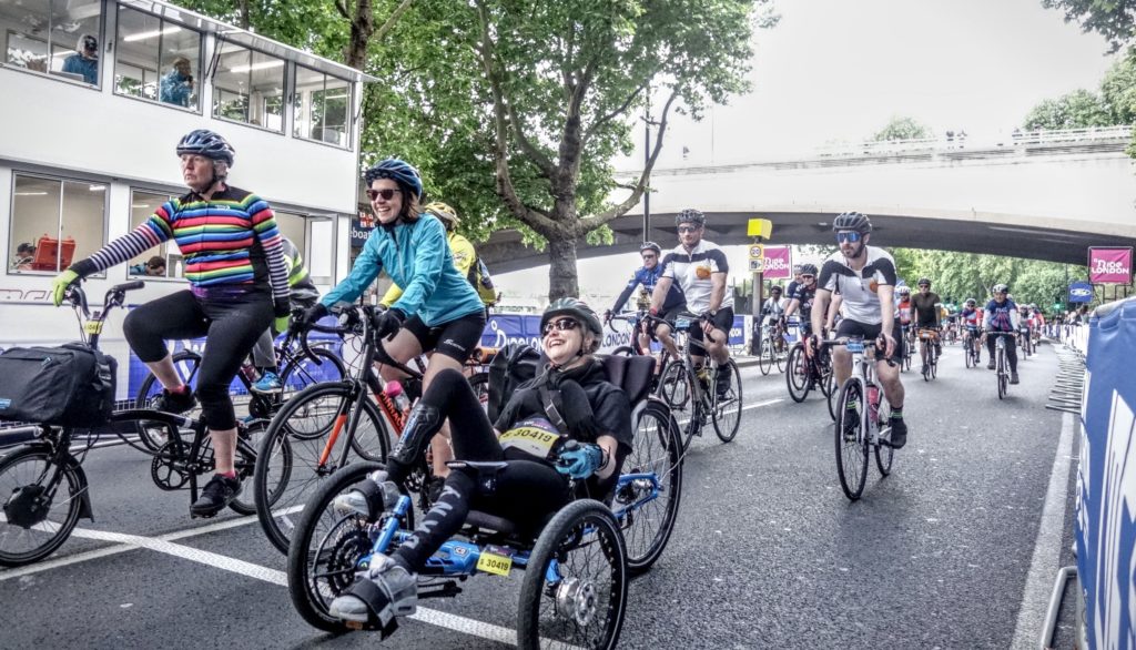 Bikeworks team members Naomi and Jamie taking on Ride London 2022 on a two-wheeler and an adapted inclusive cycle